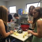 Our teenagers peeling apples.